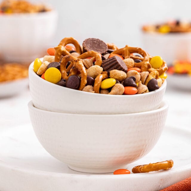 Chocolate Peanut Butter Trail Mix combined in white bowl, side view