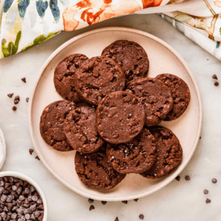 circle cocoa biscuit treats stacked on a plate