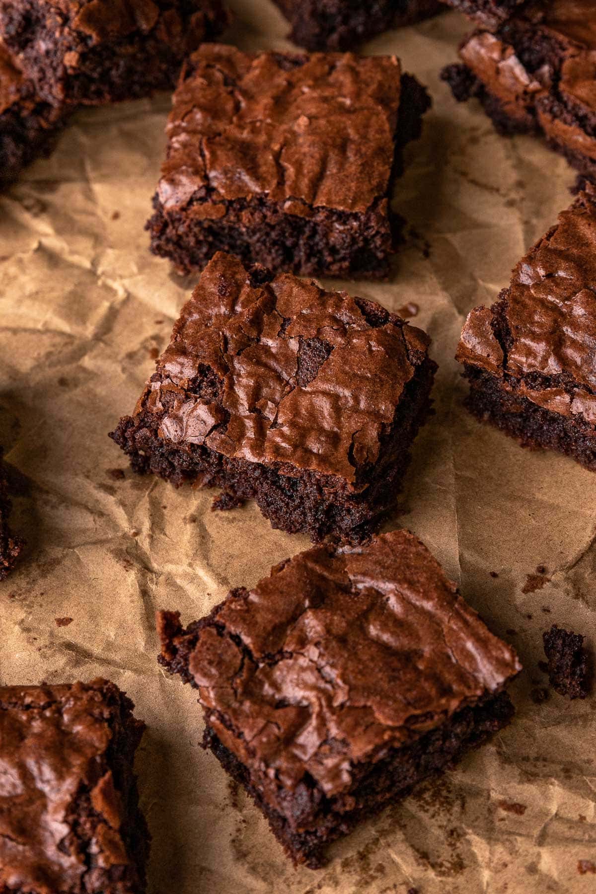 Super Rich Chocolate Brownies baked brownies spread out on parchment paper