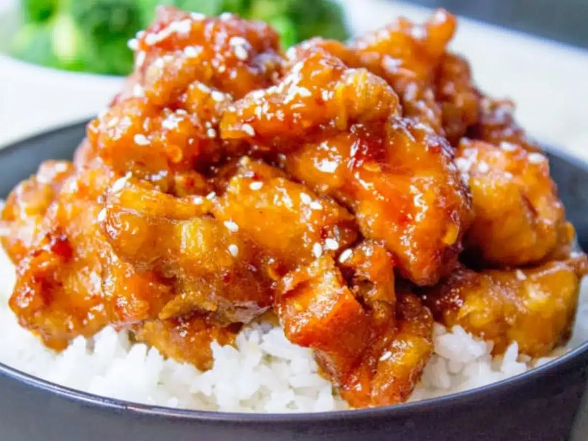View of chicken over rice in bowl