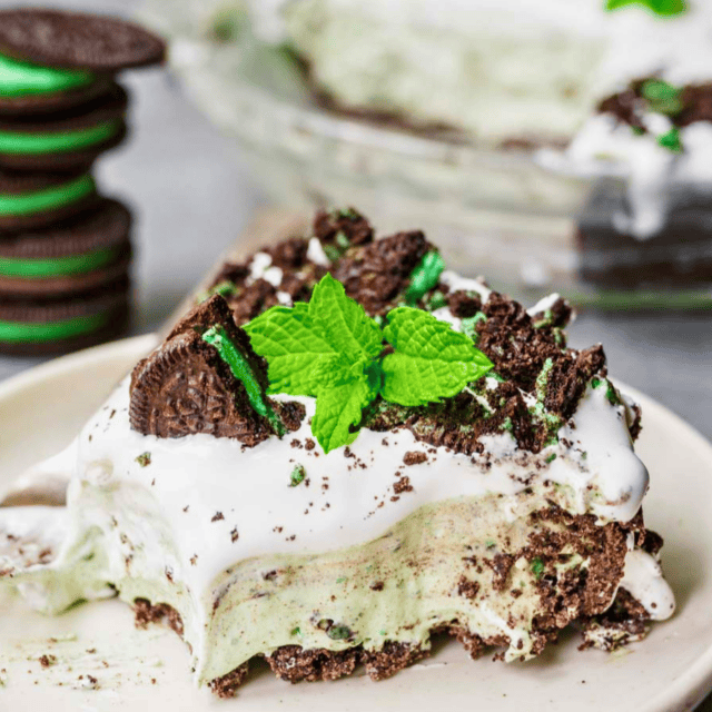 slice of green minty pie with oreos on a plate