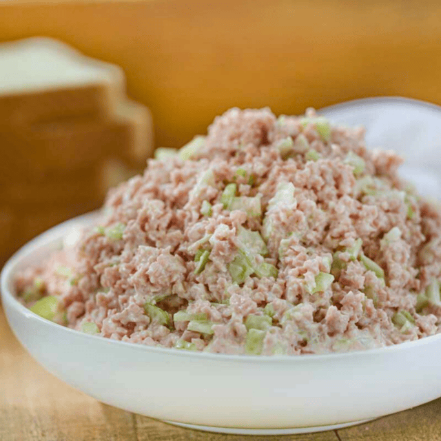 ground pork, celery, and mayo mixture in a bowl