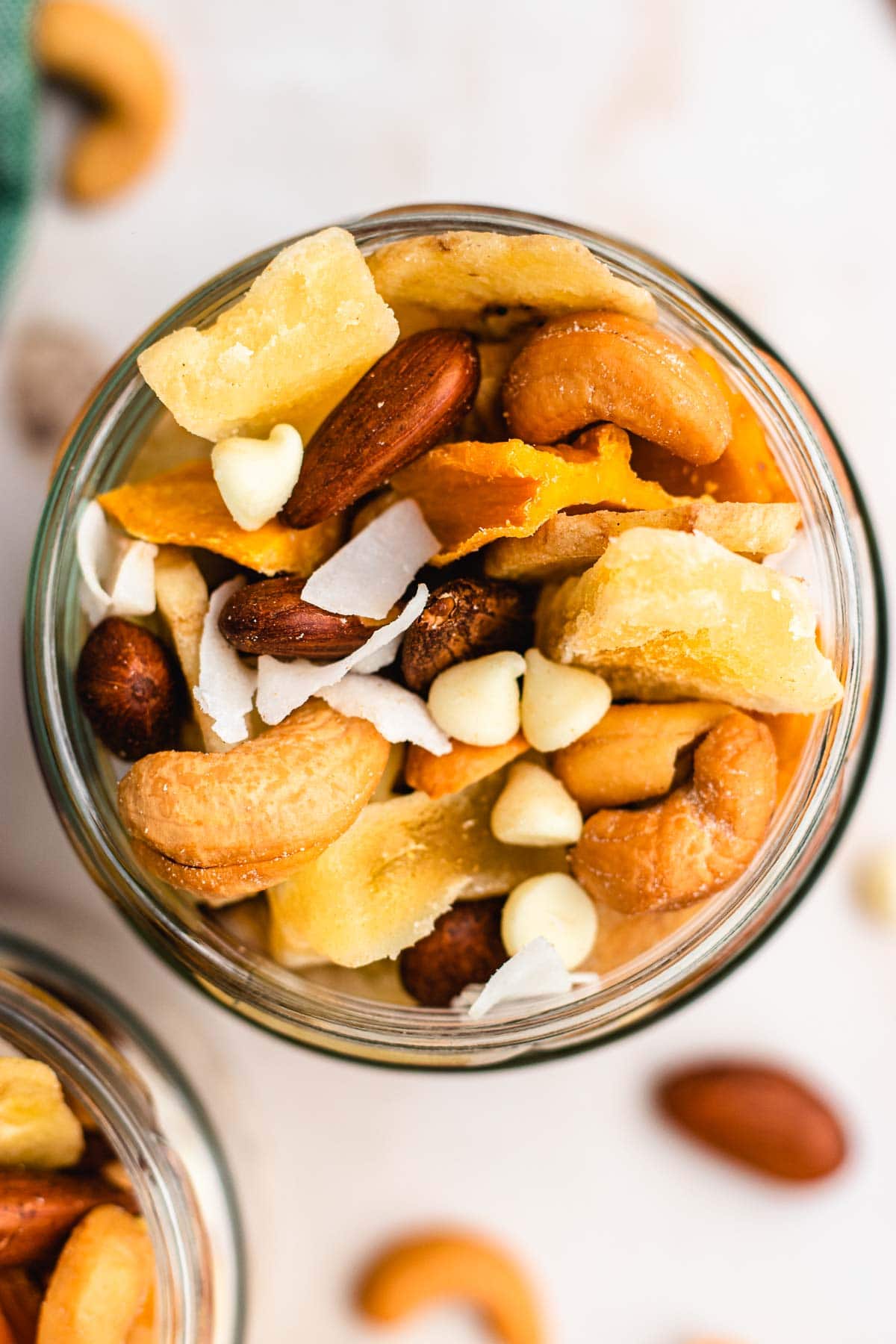 Tropical Trail Mix combined in glass jar, top down view