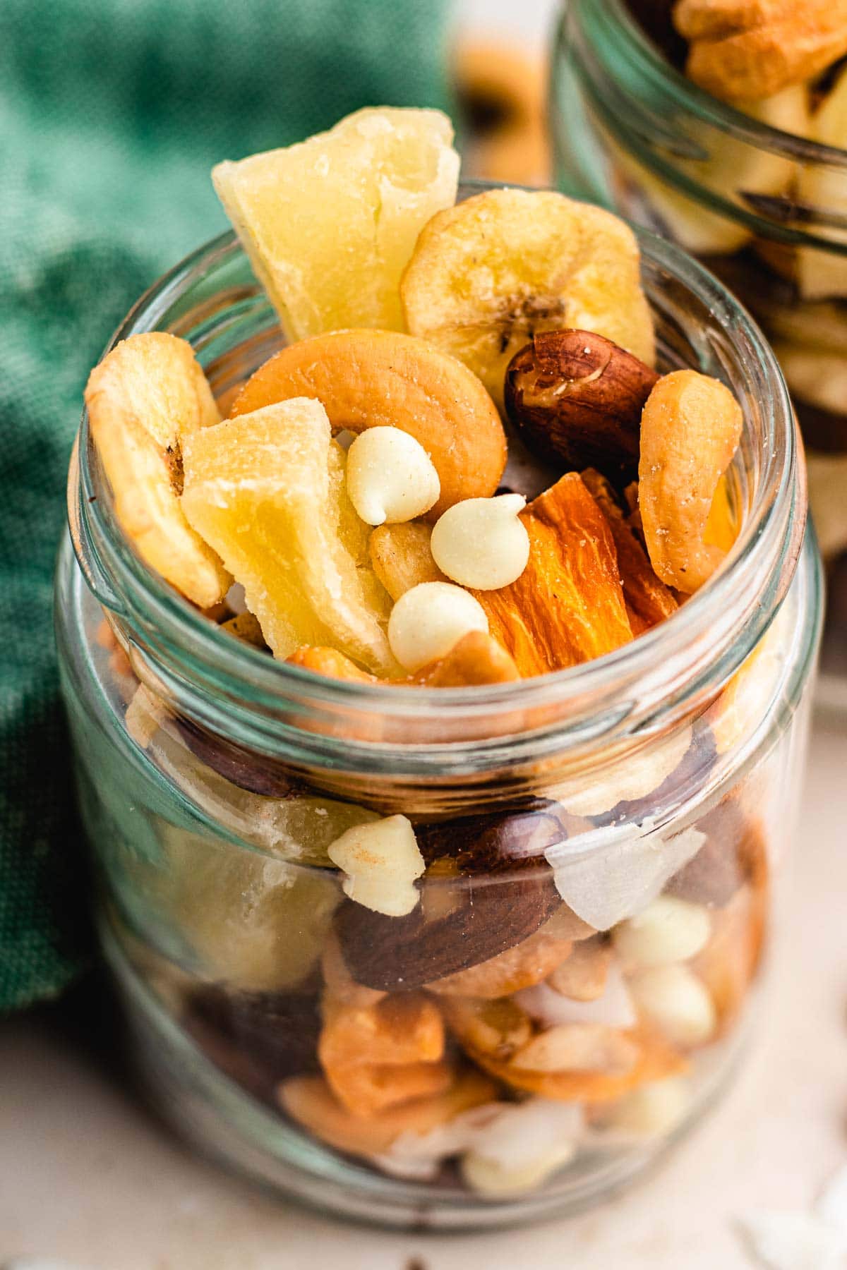 Tropical Trail Mix combined in glass jar, side angle view