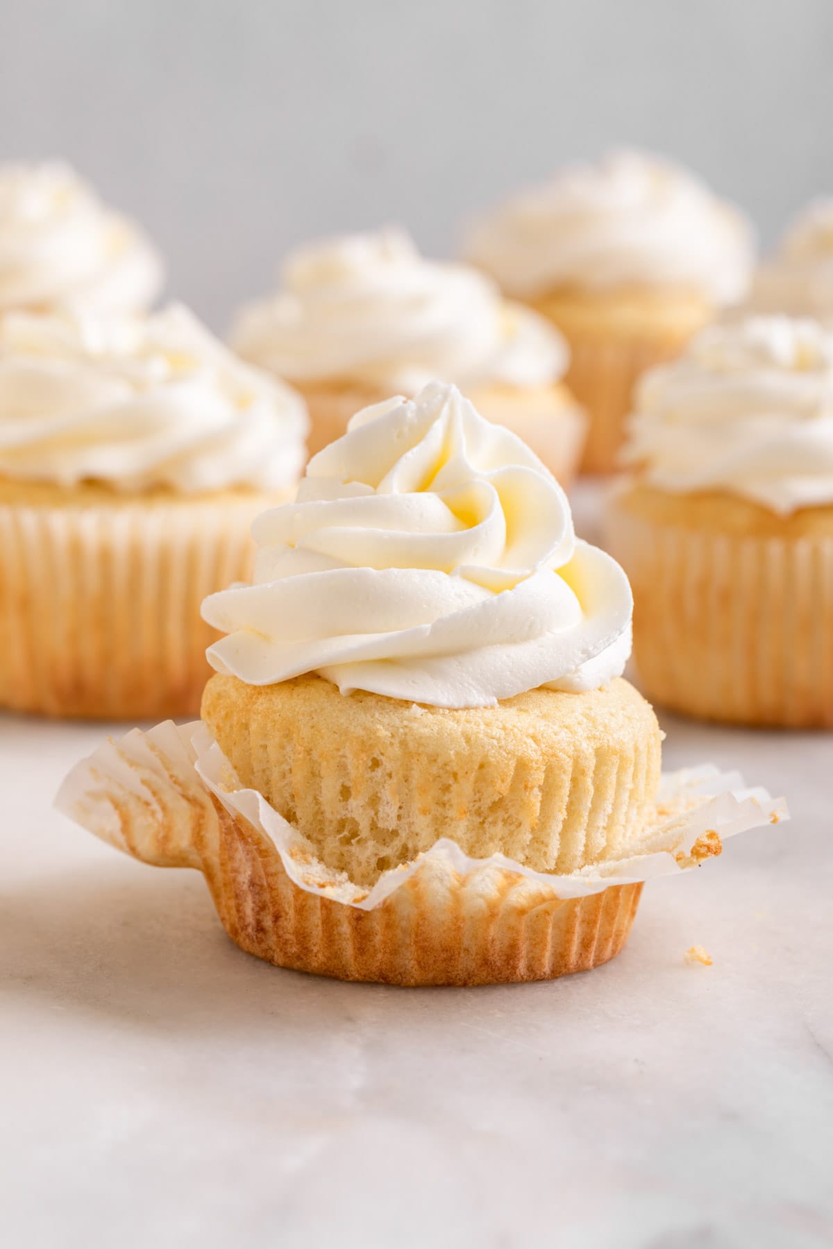 White Cupcakes Wedding Cupcakes frosted cupcakes on white background with paper liner pulled down