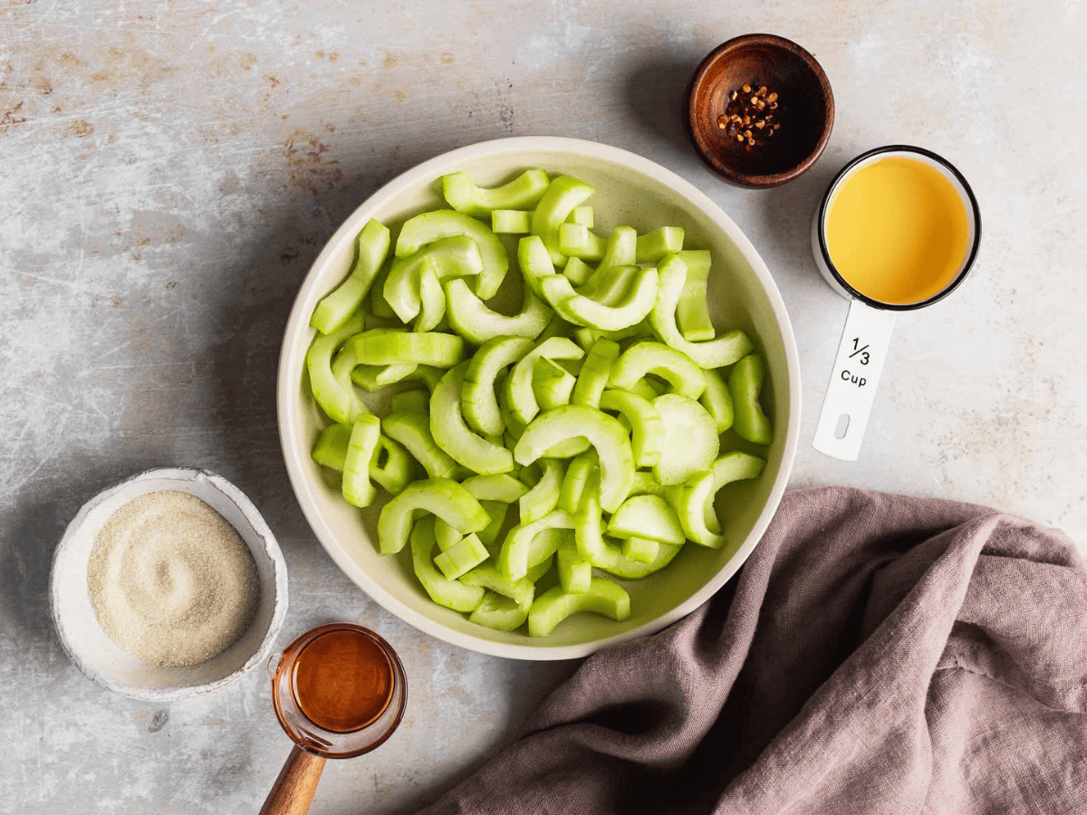 crunchy green veggies, oil, sugar, peppers, and vinegar in separate bowls
