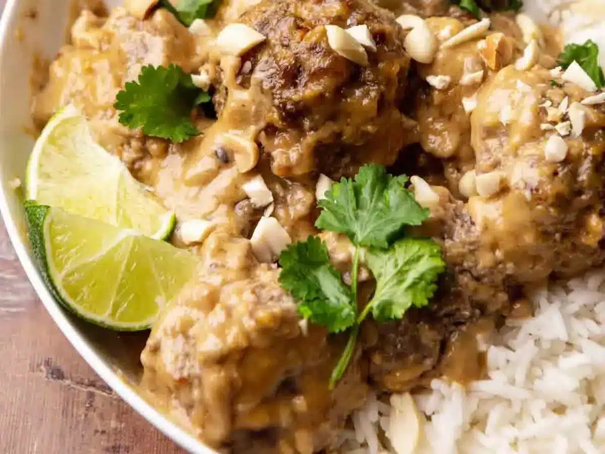 close up of meatball with rice and lime