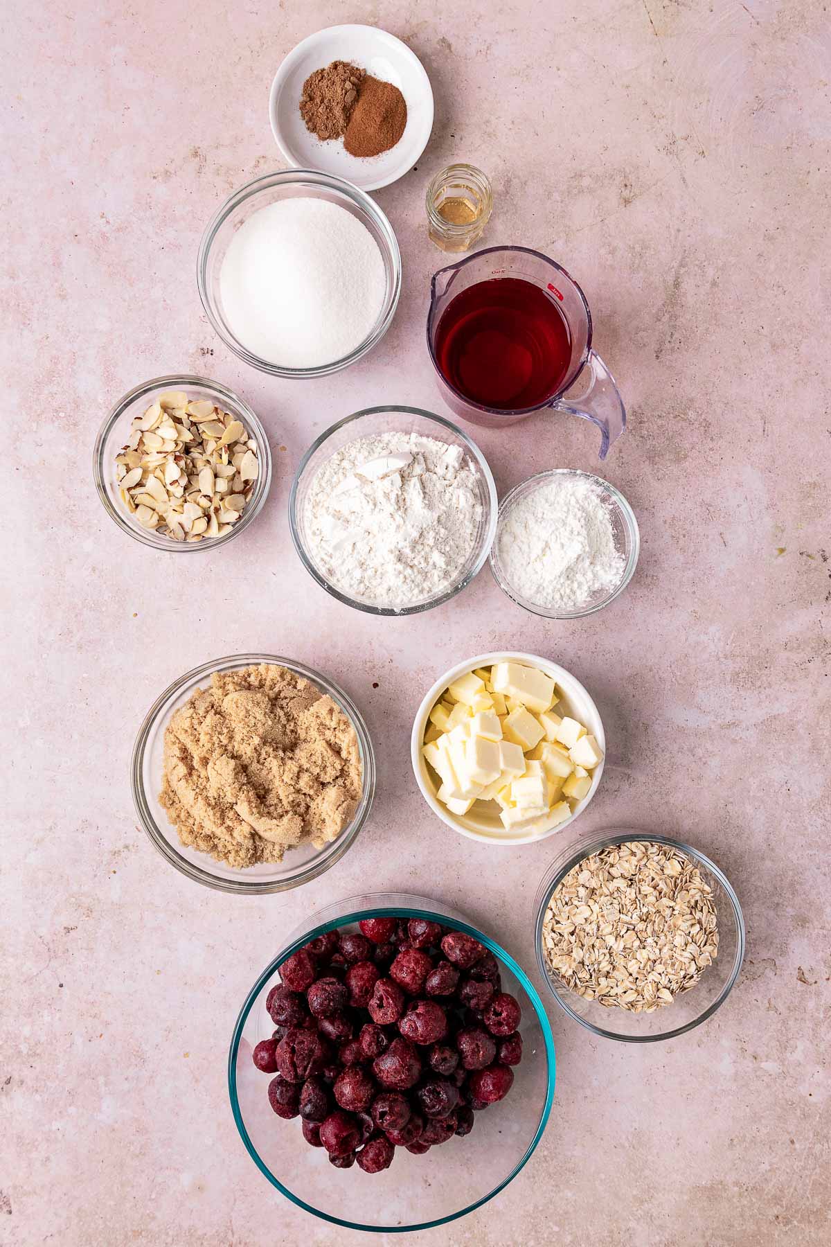 Cherry Crisp ingredients in separate bowls lined up