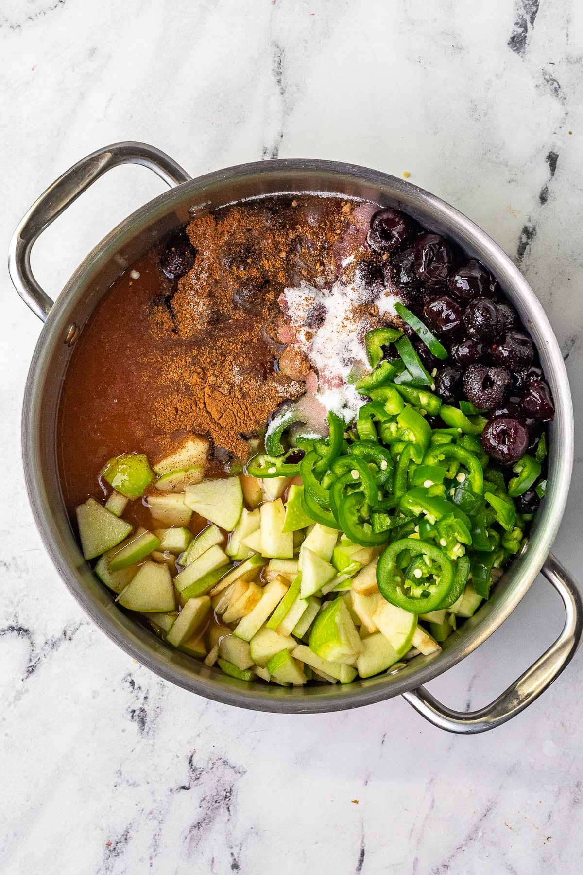 Cherry Jalapeno Jam ingredients in large pot