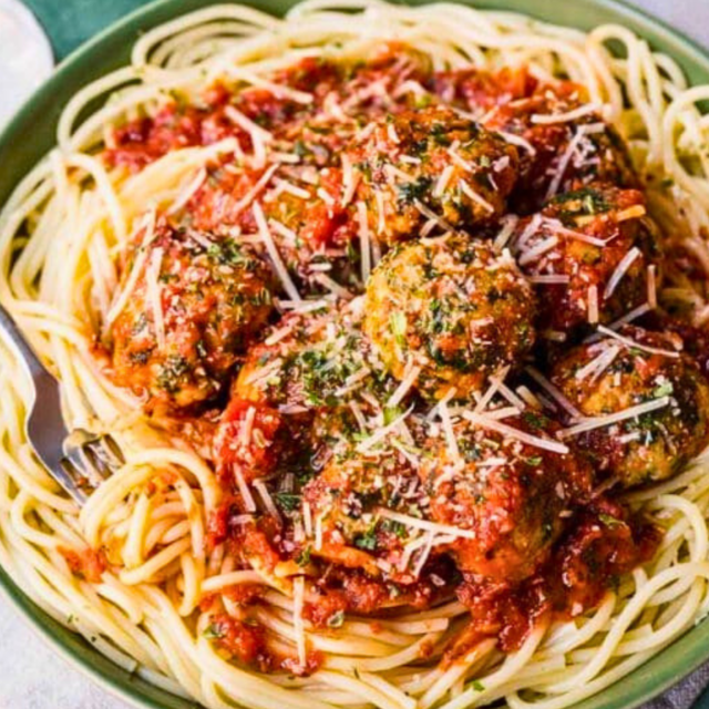 Bowl of noodles with meatballs and fork