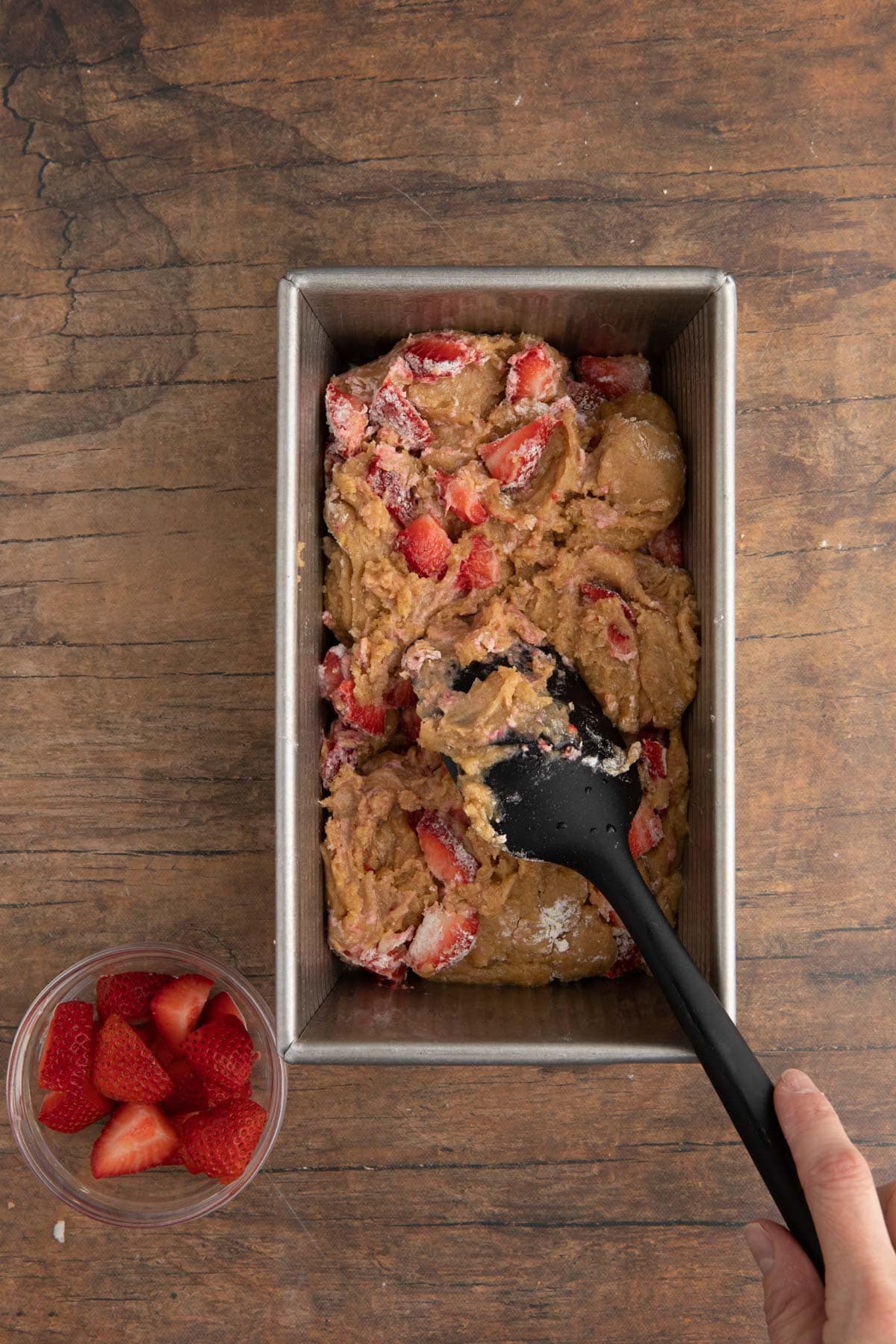 Strawberry Bread spreading batter in loaf pan