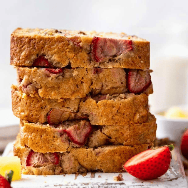 stack of sliced berry and tropical fruit loaf on a plate