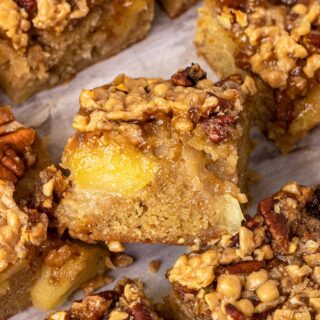 Toffee Apple Brownie Bars baked bars cut into squares and close up on one bar