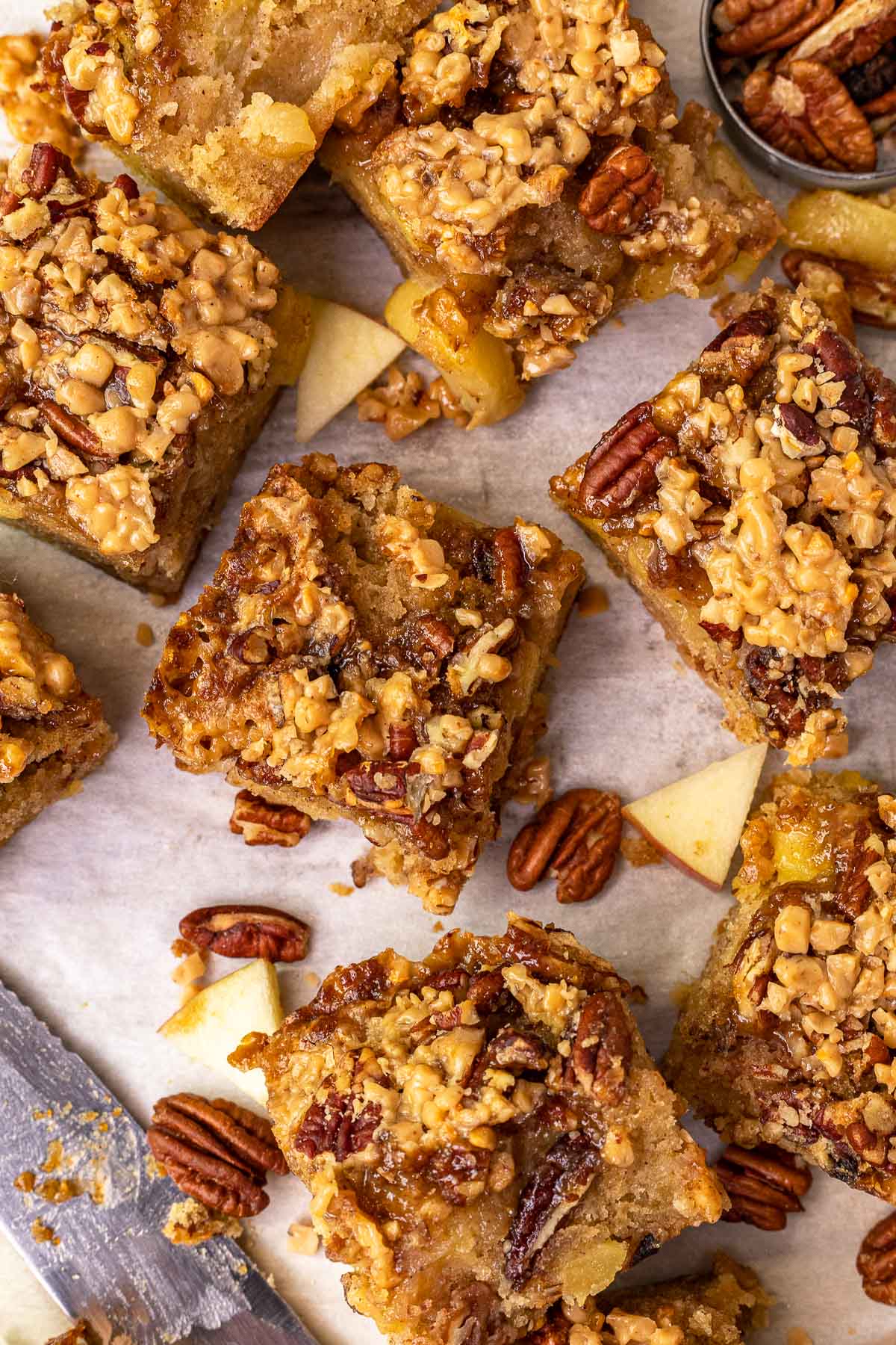 Toffee Apple Brownie Bars baked bars cut into squares on parchment paper
