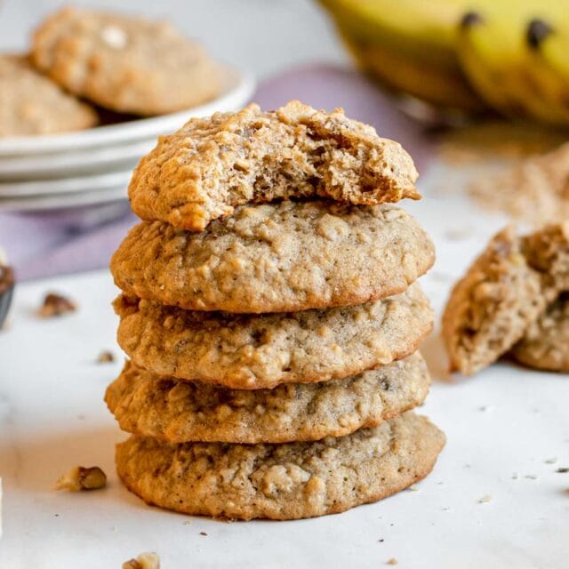 stack of five cookies with bite taken out of top cookie