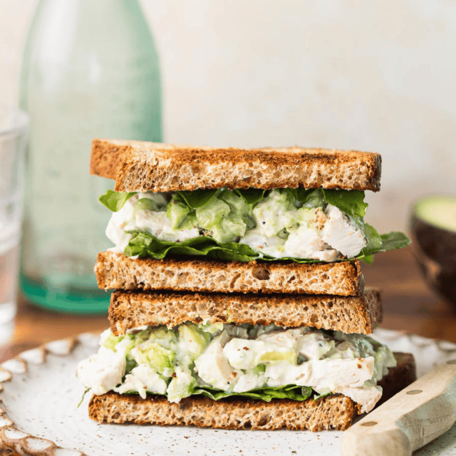 Toasted bread with creamy chicken salad and lettuce.