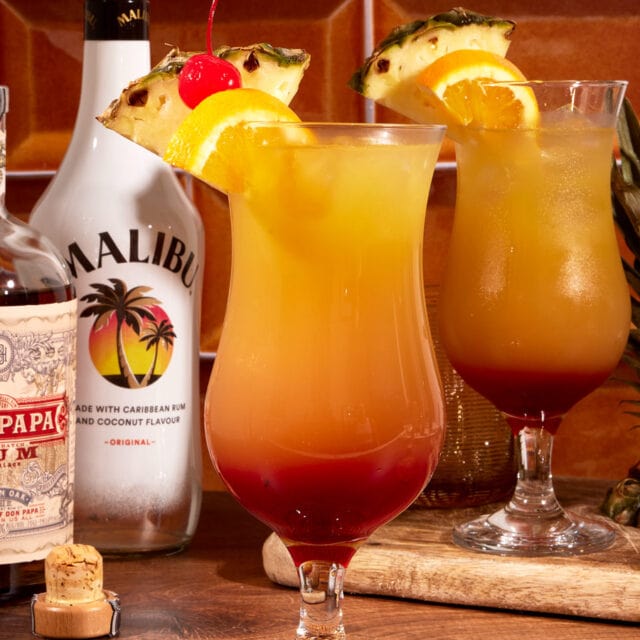 Fruity cocktail in hurricane glass.