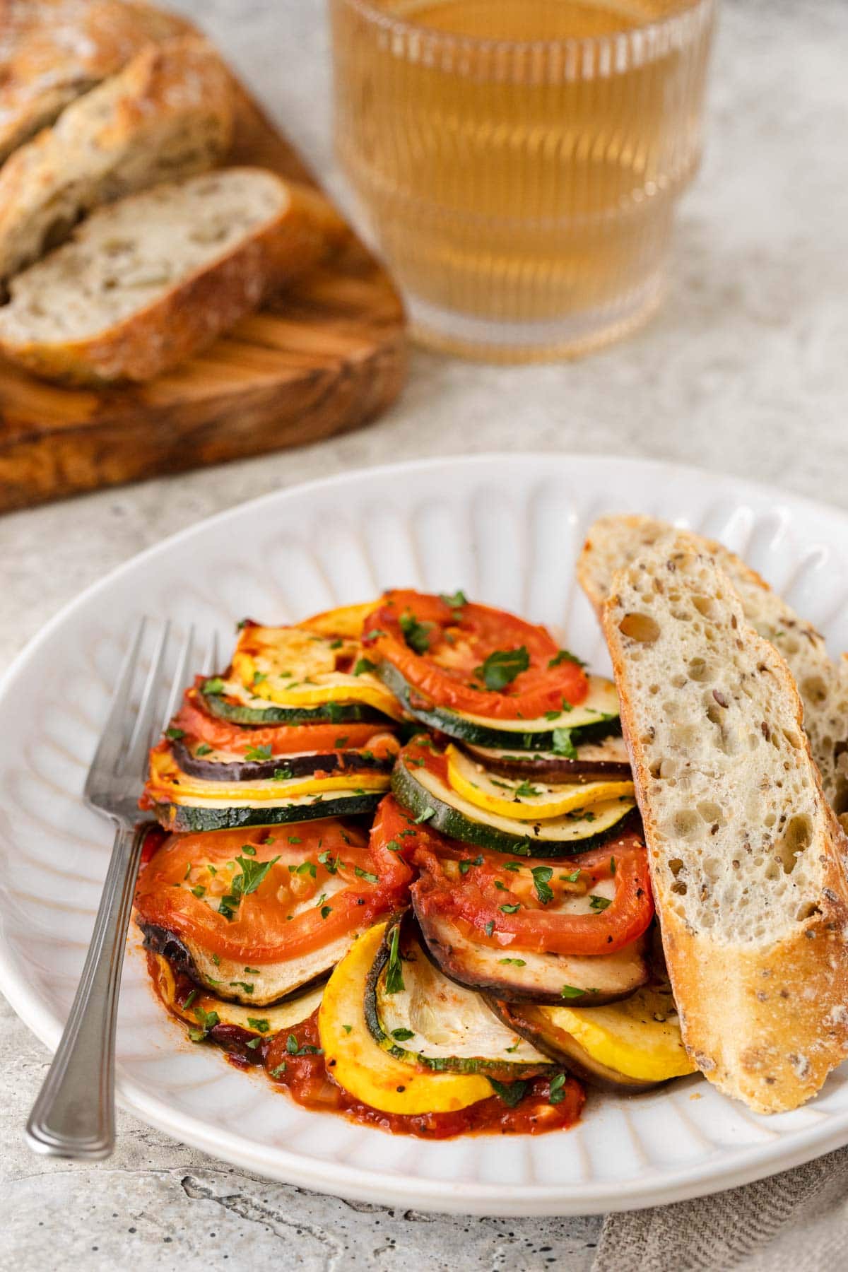 ratatouille on plate with sliced bread
