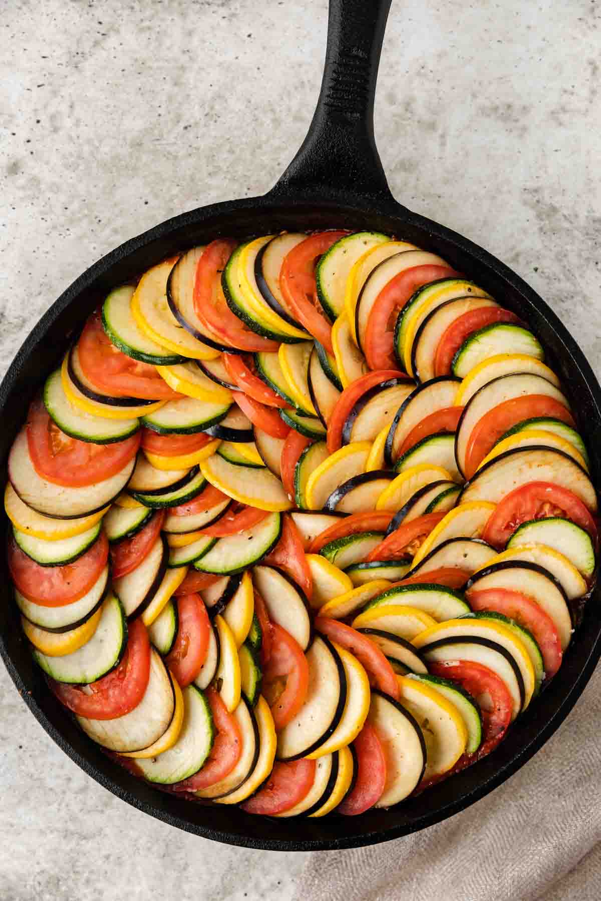 veggies layered in a skillet