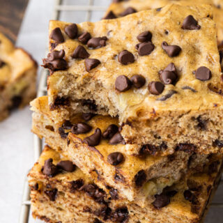 Close up of baked dessert bars with chocolate chips.