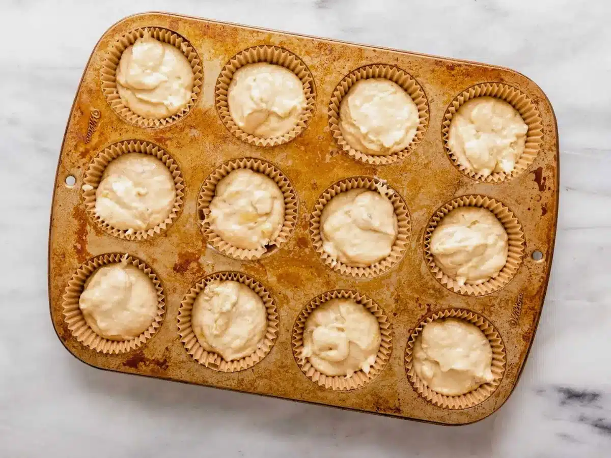 unbaked dough in a muffin tin