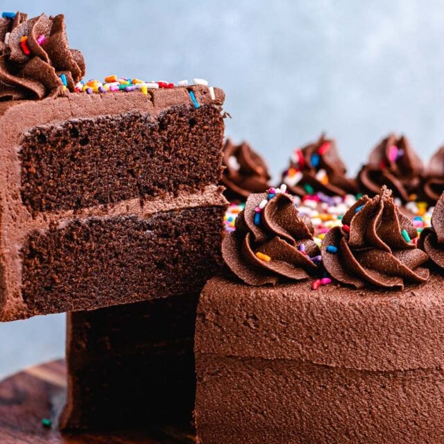 Large piece of cake being served from cake plate.