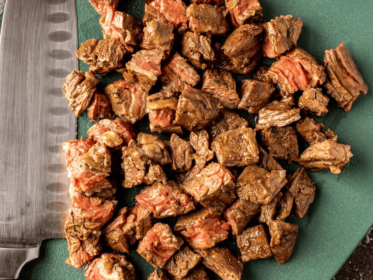 Cooked and seasoned diced beef.