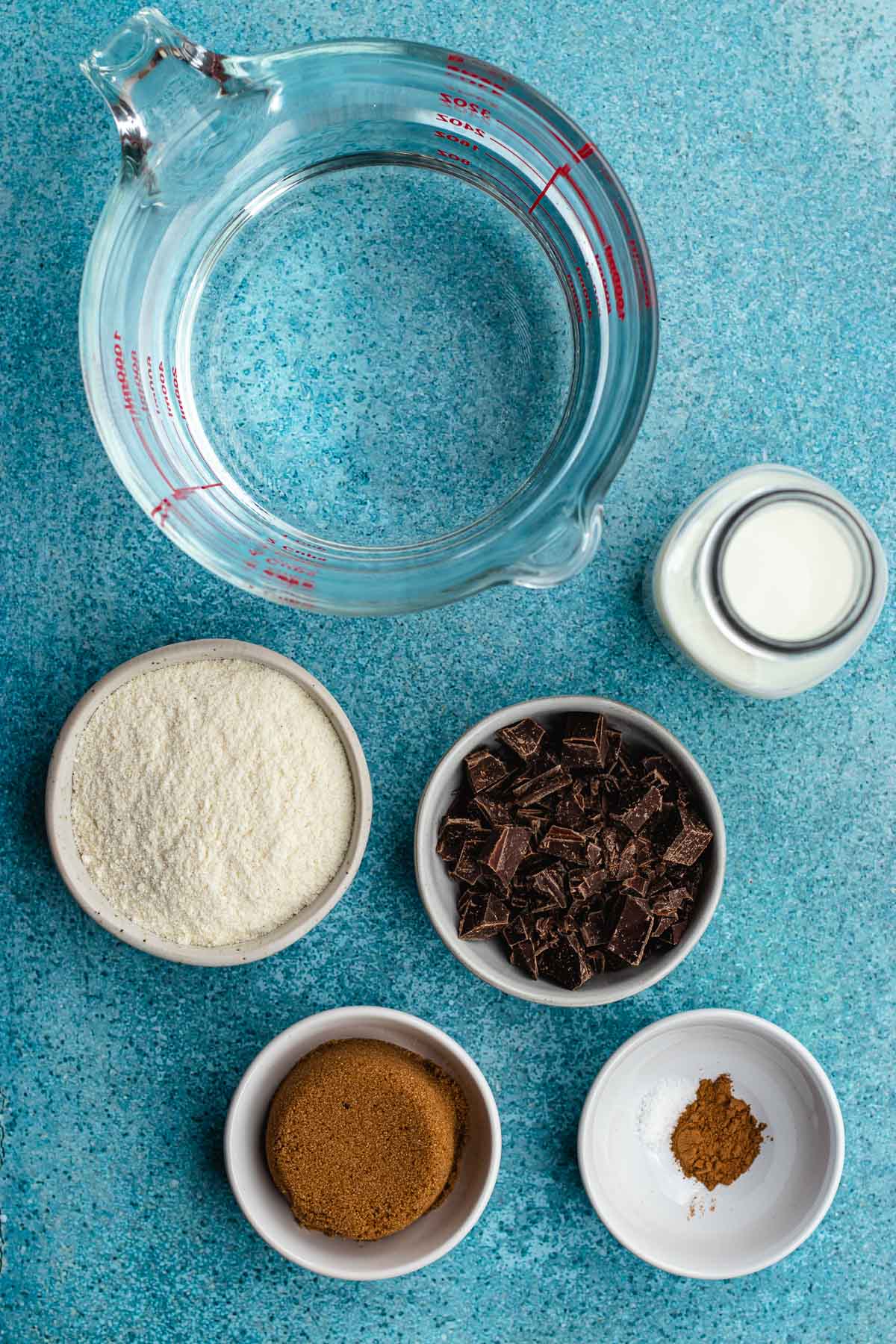 Champurrado ingredients separated in bowls and containers