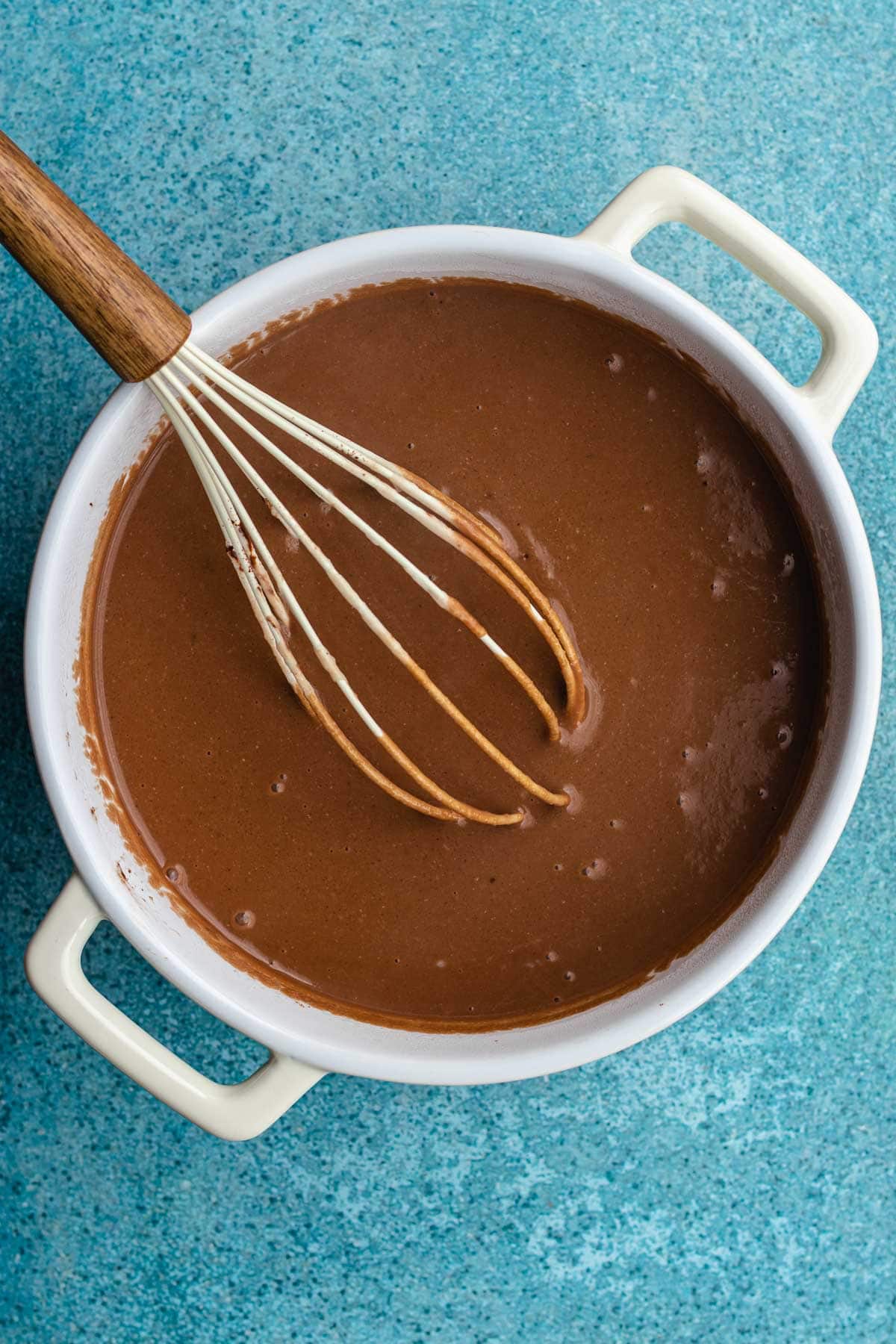 Champurrado combined in pan with whisk