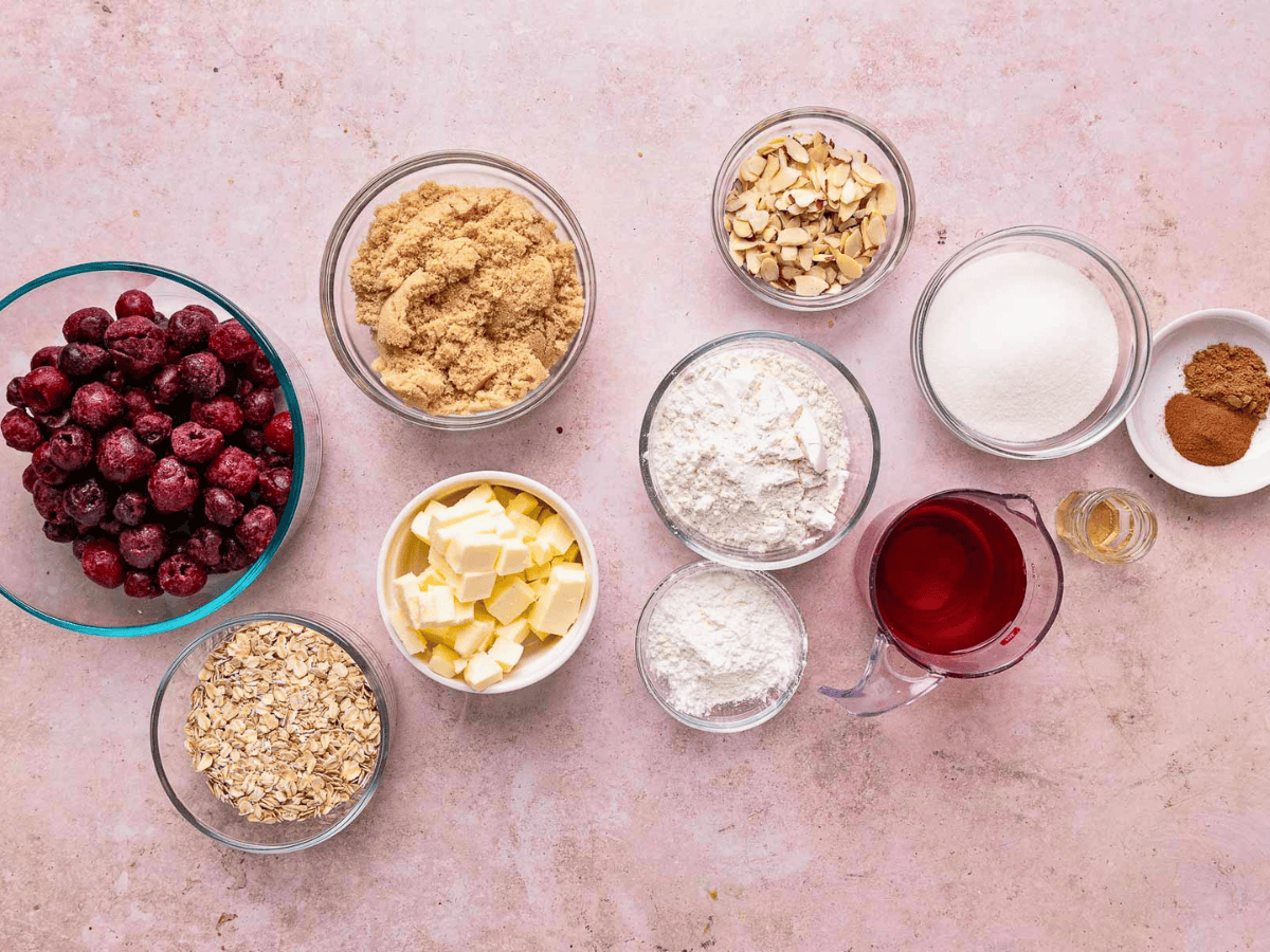 cherries, brown sugar, butter, oats, flour, sugar, and extract all in individual glass bowls