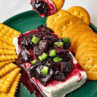 Jam on top of cream cheese with crackers