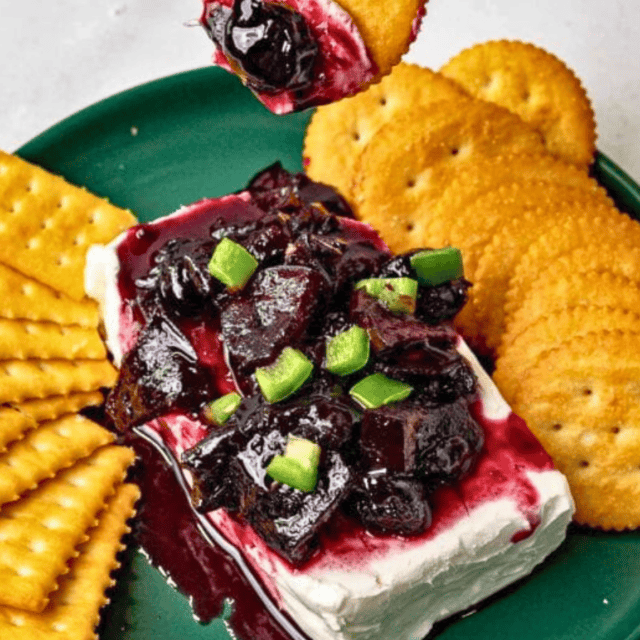 Jam on top of cream cheese with crackers