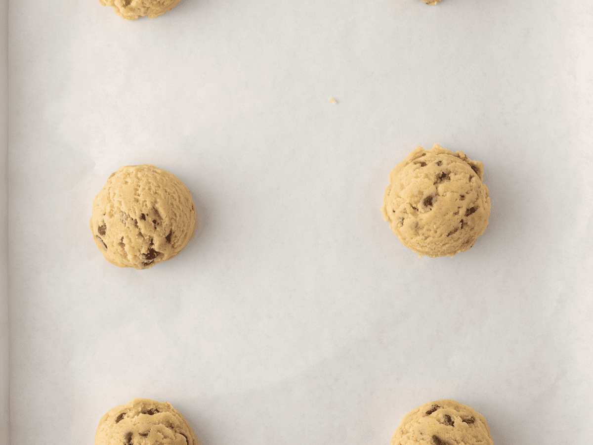 Scoops of dough on baking sheet.
