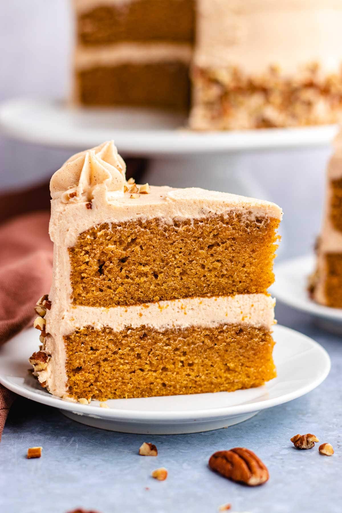 Cinnamon Cream Cheese Frosting layer cake slice frosted on plate