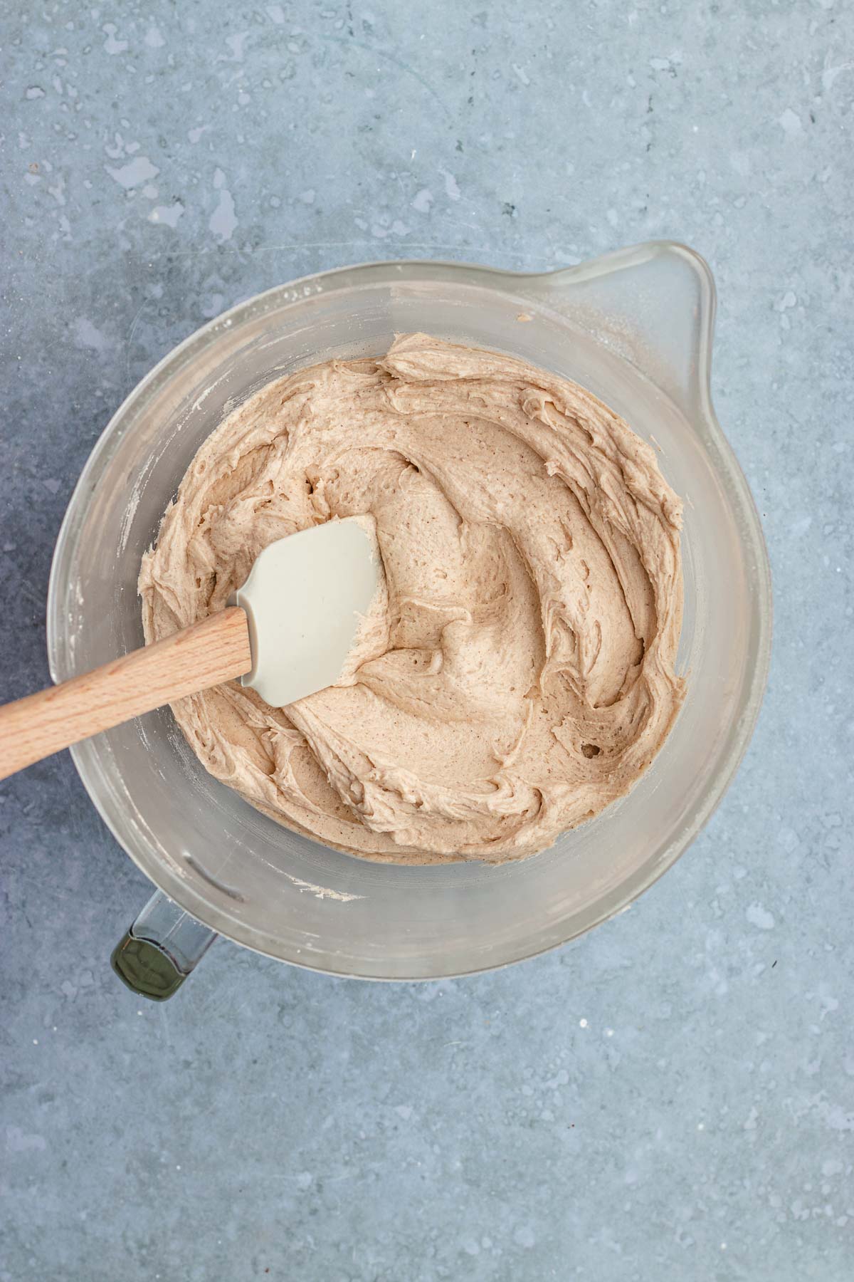 Cinnamon Cream Cheese Frosting mixed in bowl with spatula
