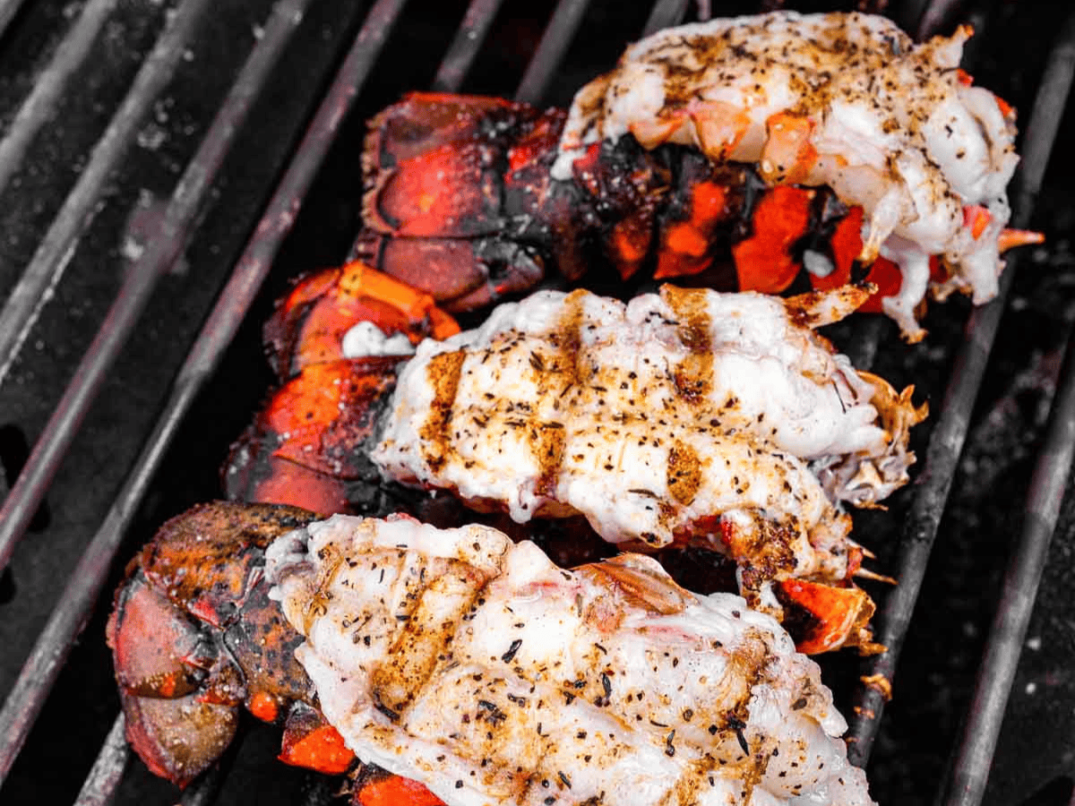 Seafood cooking on grill.