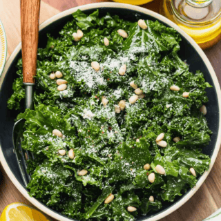 Green salad topped with parmesan and pine nuts.