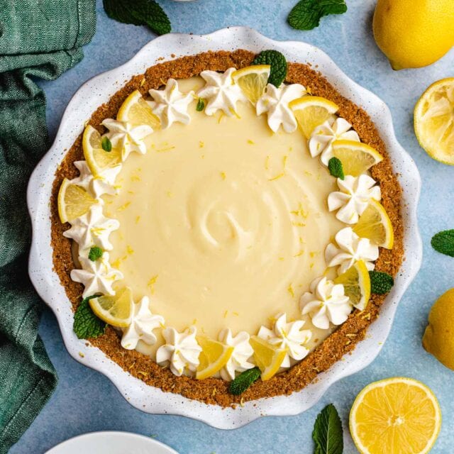 Lemon Pie finished pie with whipped cream and lemon slice garnishes around edge