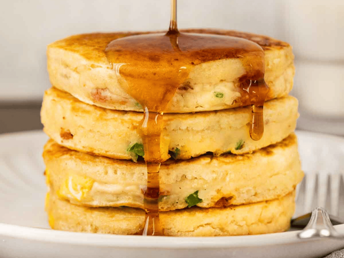 pancakes on a plate with syrup dripping