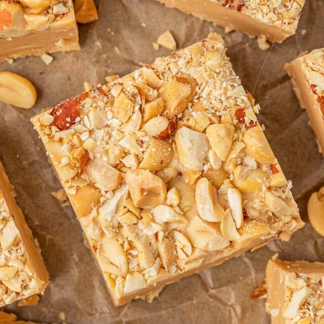 Top view of rich candy square with peanut topping.