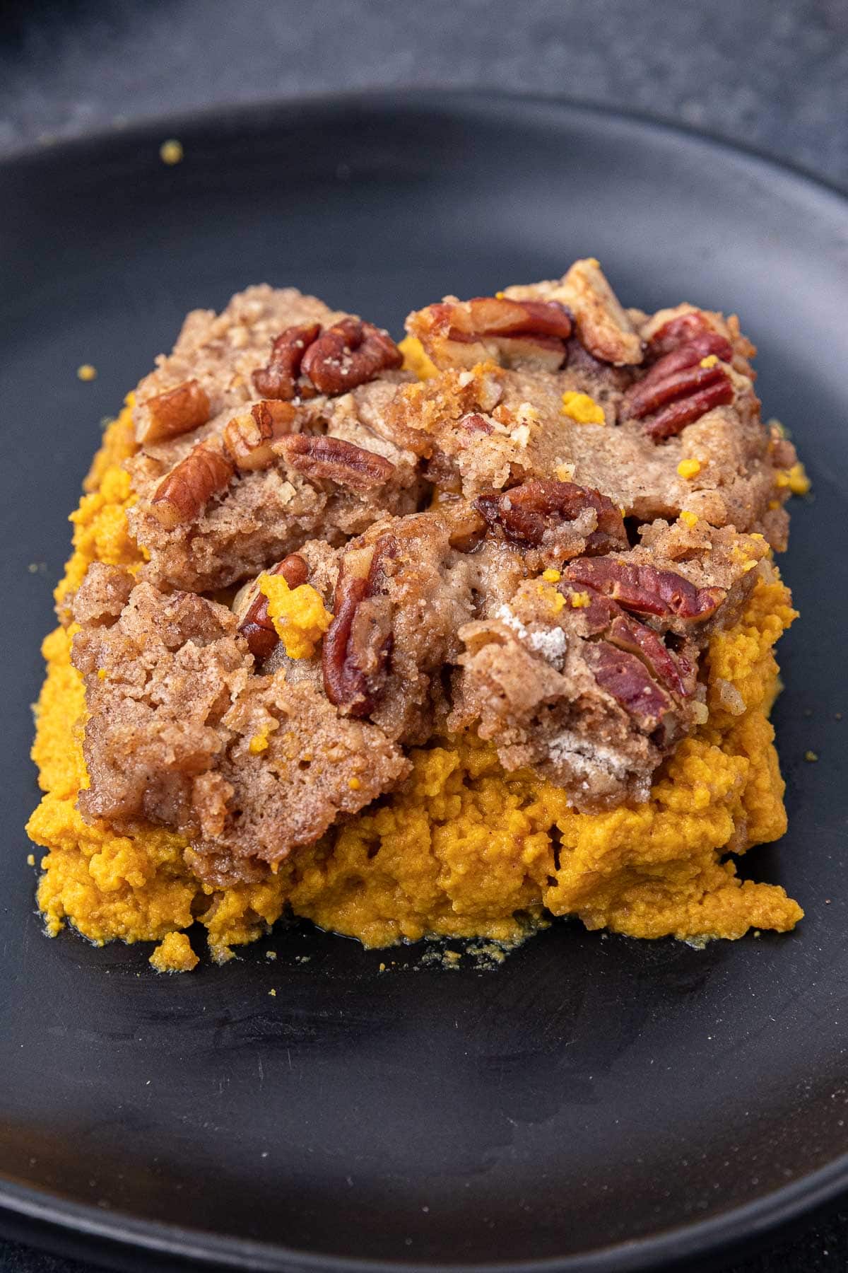 Close up of one slice of Pumpkin Dump Cake.