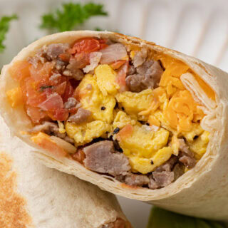 Close up of burrito cut in half.