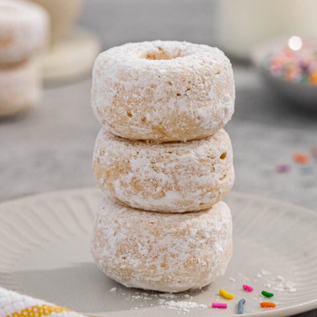 Tiny donuts tossed in powdered sugar.