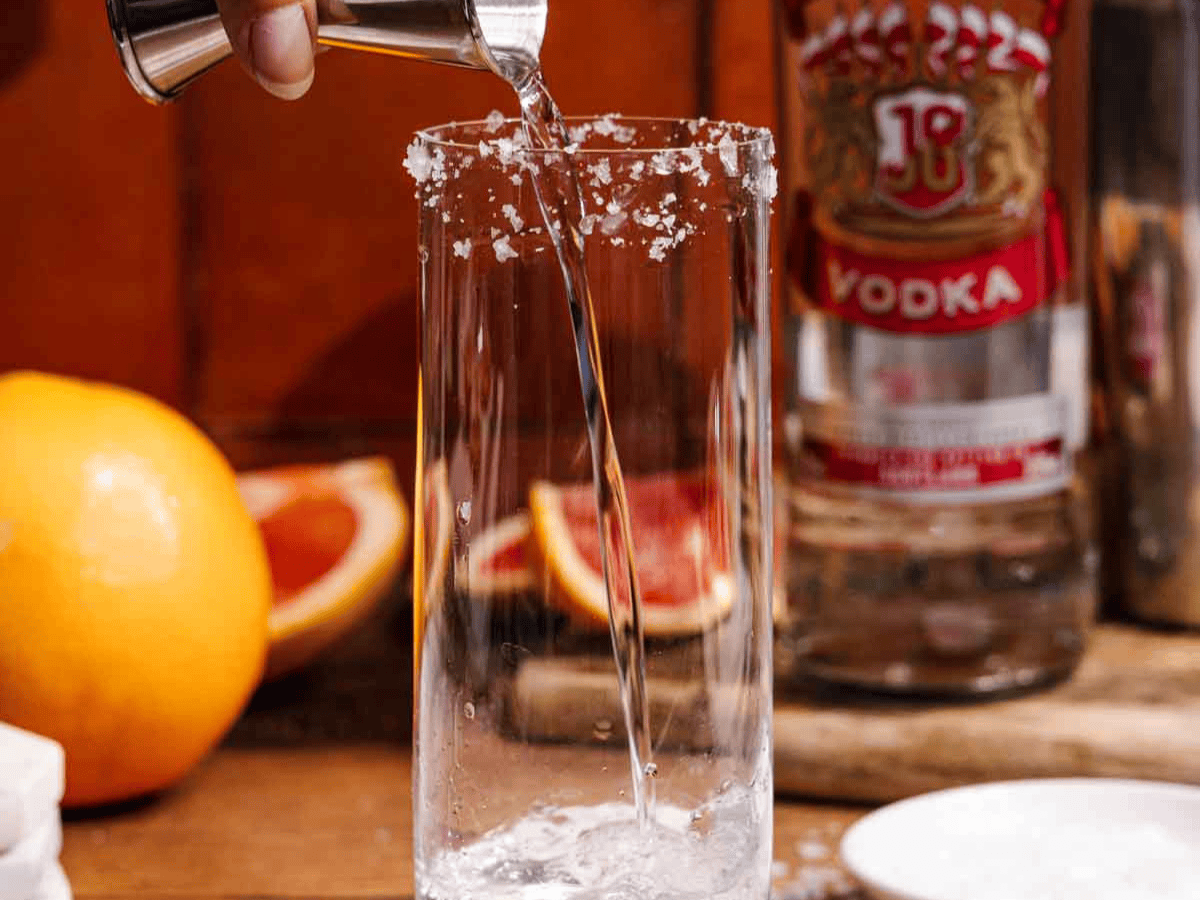 Vodka being poured into glass.