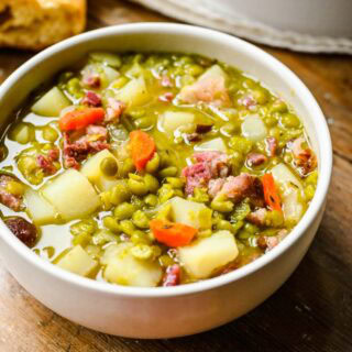 Bowl of soup with peas and ham 4x3