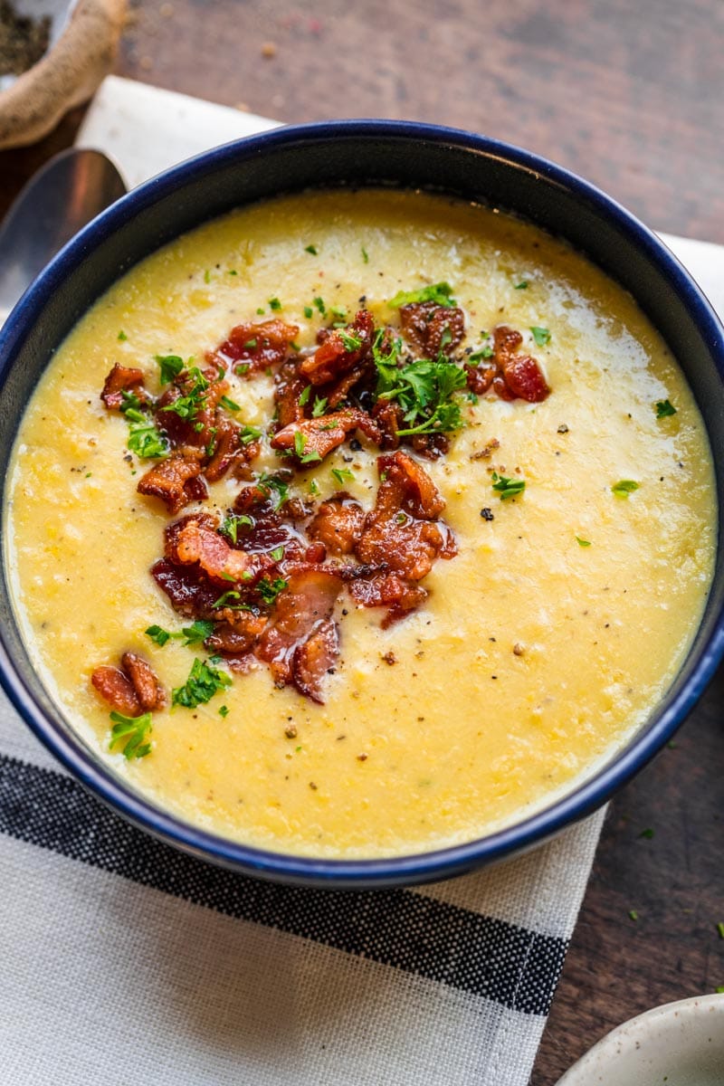 Sweet Corn Soup finished soup in bowl with bacon and onions on top