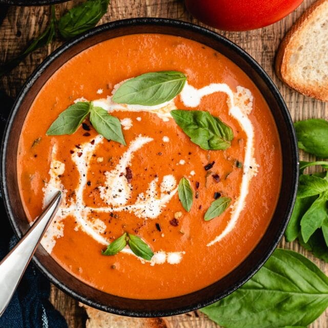 Creamy soup in bowl with spoon 4x3
