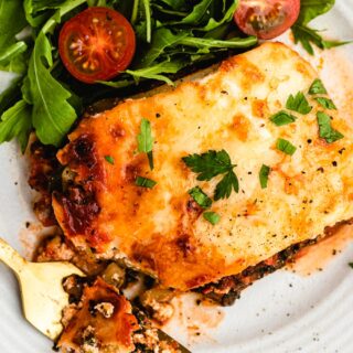 Piece of lasagna on plate.