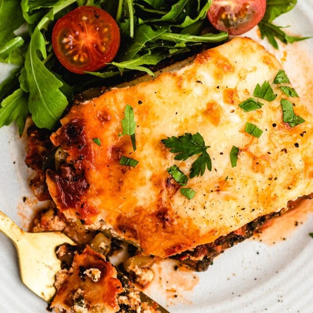 Piece of lasagna on plate.