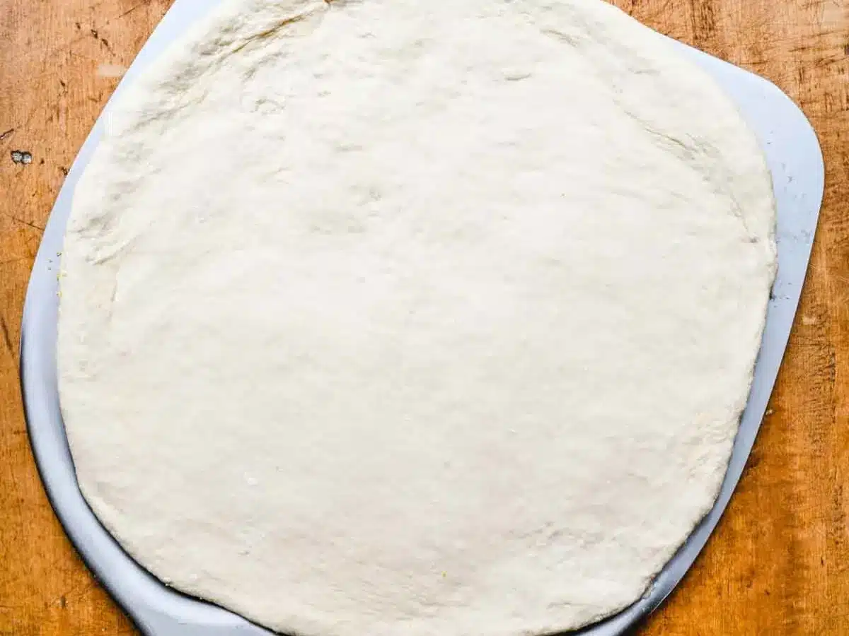 Dough rolled into circle.